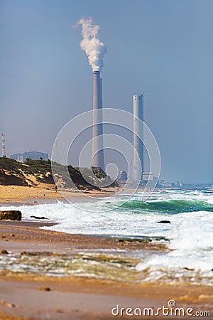 Smokestack pipe factory on the shore Stock Photo