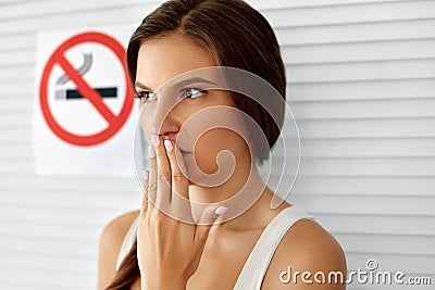 Smoking. Beautiful Woman With No Smoking Sign On Background Stock Photo