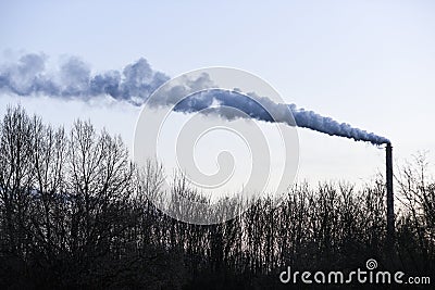 Smoking chimney from a factory in Poland Stock Photo