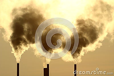 Smoking greenhouse chimneys Stock Photo