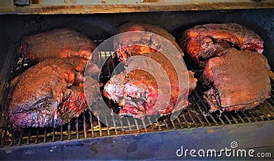 Smoking Pork Shoulders on a Traeger Pellet Smoker Stock Photo