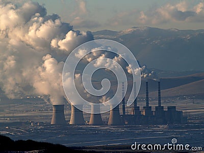 Smoking power station chimneys Stock Photo