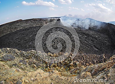 Smoking volcanic pinnacle close to Erta Ale volcano, Ethiopia Stock Photo