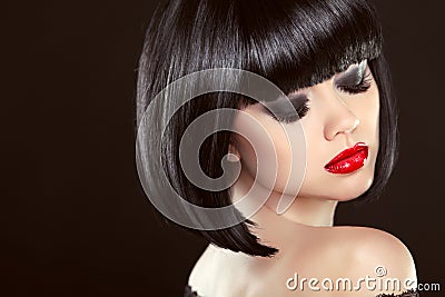 Smoky eyes makeup closeup. Black bob hairstyle. red lips Stock Photo