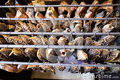 Smoky fish in smokehouse Stock Photo