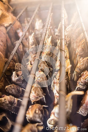 Smoky fish in smokehouse Stock Photo