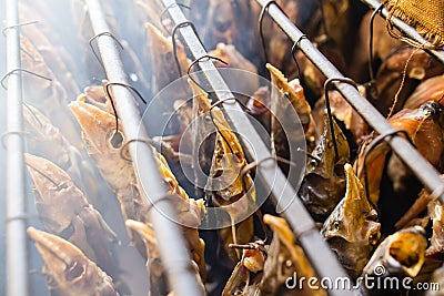 Smoky fish in smokehouse Stock Photo