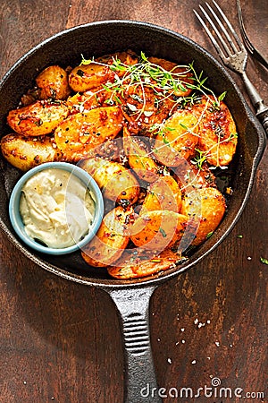 Smoky spiced new potatoes with garlic aioli mayonnaise dip Stock Photo