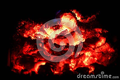 Smoldering ashes of a bonfire Stock Photo