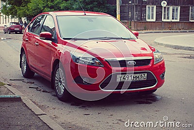 Red Ford Focus parked in street olf old russian city Smolensk. Editorial Stock Photo