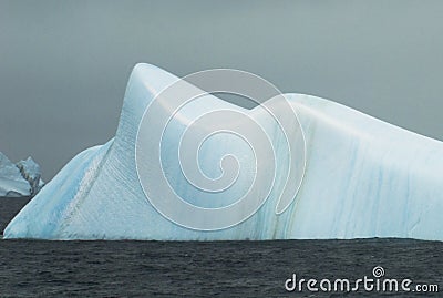 Smooth blue iceberg Stock Photo