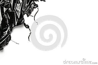 Smooth texture. Black shiny film bag pattern isolated on white with copy space. Wrap transparent dark cellophane background. Real Stock Photo
