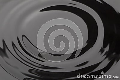 Smooth wave on dark water Stock Photo