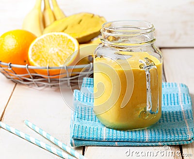 Smoothie of banana, orange, mango Stock Photo