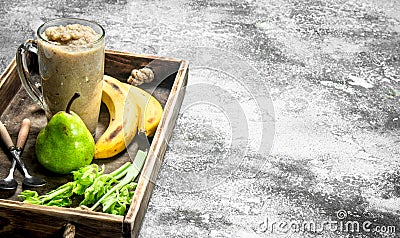 Smoothie with banana, pear and celery Stock Photo