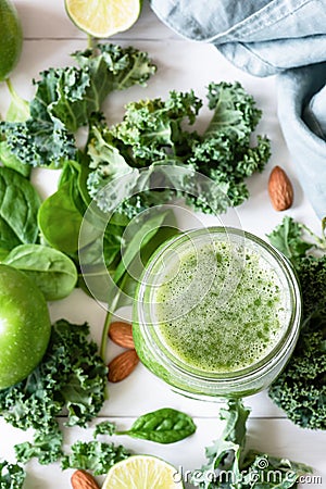 Smoothie detox with green fruits, vegetables, spinach and kale on white Stock Photo