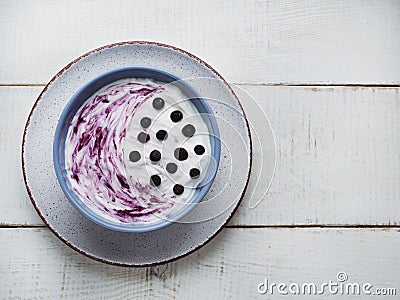 Smoothie, fresh berries, vintage bowl and spoon Stock Photo