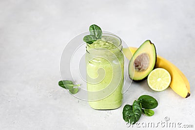 Smoothies with banana, avocado, spinach, lime Stock Photo