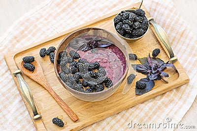 Smoothies bowl with banana, ground flax and mulberry Stock Photo