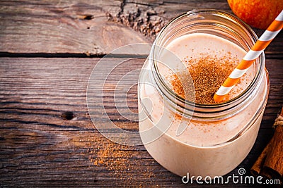 Smoothies with red apple and cinnamon in a glass mason jar Stock Photo