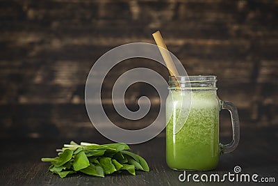 Smoothies from wild leek, honey and banana in a glass mug, close up Stock Photo