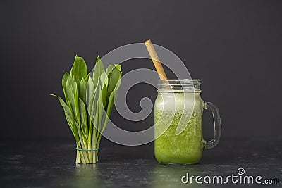 Smoothies from wild leek, honey and banana in a glass mug, close up Stock Photo