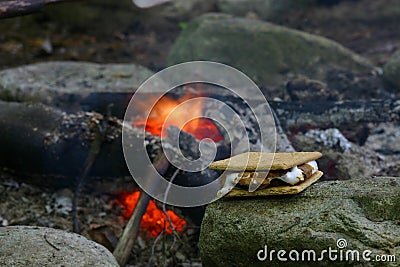 Smore Beside a Campfire Stock Photo