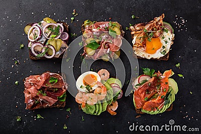 Smorrebrod, traditional Danish open sanwiches, dark rye bread wi Stock Photo