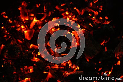 Smouldering coals at night. Decaying charcoal, New Year`s Eve barbecue season Stock Photo