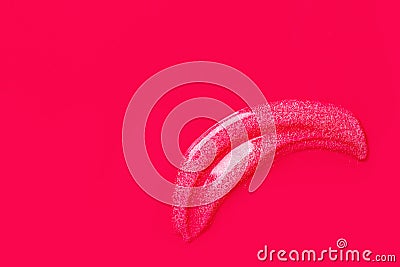 Smudged stroke of transparent cleanser scrub gel on fuchsia pink background. Skin care beauty organic cosmetics wellness concept. Stock Photo