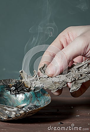 Smudging sage on abalone shell. Copy space for text. Burning sage creates fragrant smoke. Native American tradition. It can be use Stock Photo
