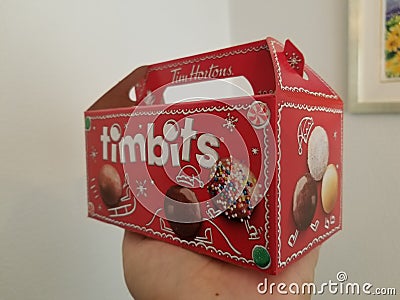 Snacking on 10 different kinds of Timbits Editorial Stock Photo