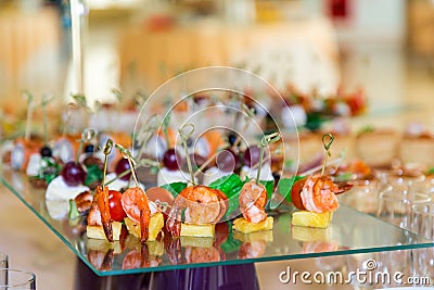 Snacks, fish and meat specialities on the buffet. A gala reception. Served tables. Catering Stock Photo