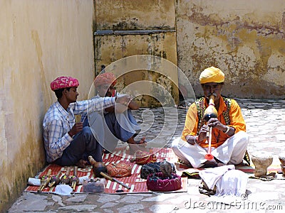 Snake charmers in one of the courtyards of the Amber fort in Jaipur, India Editorial Stock Photo