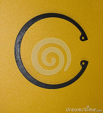 Snap ring inner DIN 472 on a yellow background Stock Photo