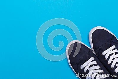 Sneakers on blue background. Fashion blog or magazine concept Stock Photo