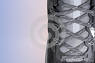 Sneakers close-up. Shoelaces of new sports shoes in gray, lacing sneakers close-up, top view. Mesh elastic laces for Stock Photo