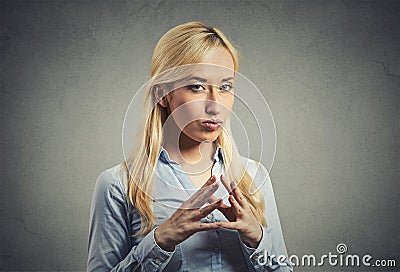 Sneaky, sly, scheming young woman plotting revenge plan Stock Photo