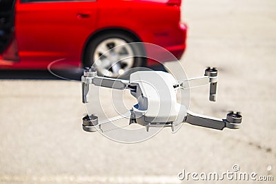 DJI Mavic Mini drone in flight back view Editorial Stock Photo