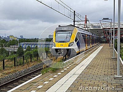 SNG local commuter train at platform of train station Duivendrecht Editorial Stock Photo
