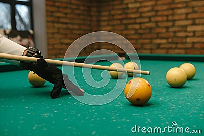 Snooker. close-up . male hands with cue playing billiards Stock Photo