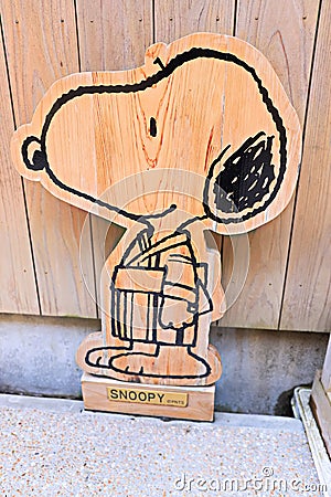 Snoopy smile funny face cute Peanuts comics character woodwork statue Editorial Stock Photo