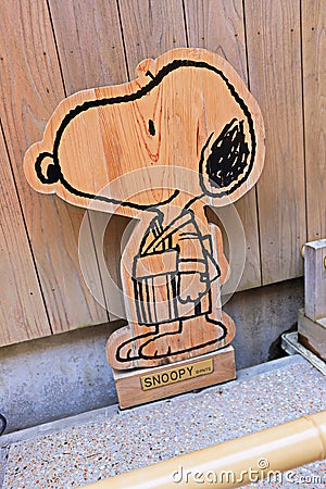 Snoopy smile funny face cute Peanuts comics character woodwork statue Editorial Stock Photo