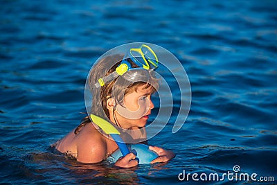 Snorkeling diving. Child dives into the water. Extreme sport. Kids summer holidays. Stock Photo