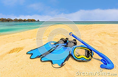 Snorkeling gear on the beach with water bungalows and the beach i Stock Photo
