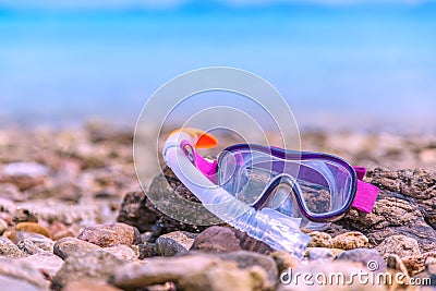 Snorkeling Mask Dry Snorkel Water Sports Gear on Stone Beach Coastline Sea Relax Summer Vacation Holiday Concept Tone Stock Photo