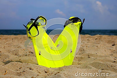 Snorkeling mask and fins on the sandy beach Stock Photo