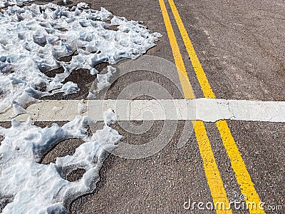 Snow on asphalt at the Seismiles Route in Catamarca, Argentina Stock Photo