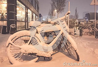 Snow on bikes in front of a house Editorial Stock Photo