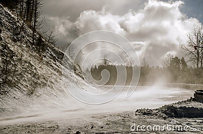 Snow Blowing Across a Road Stock Photo